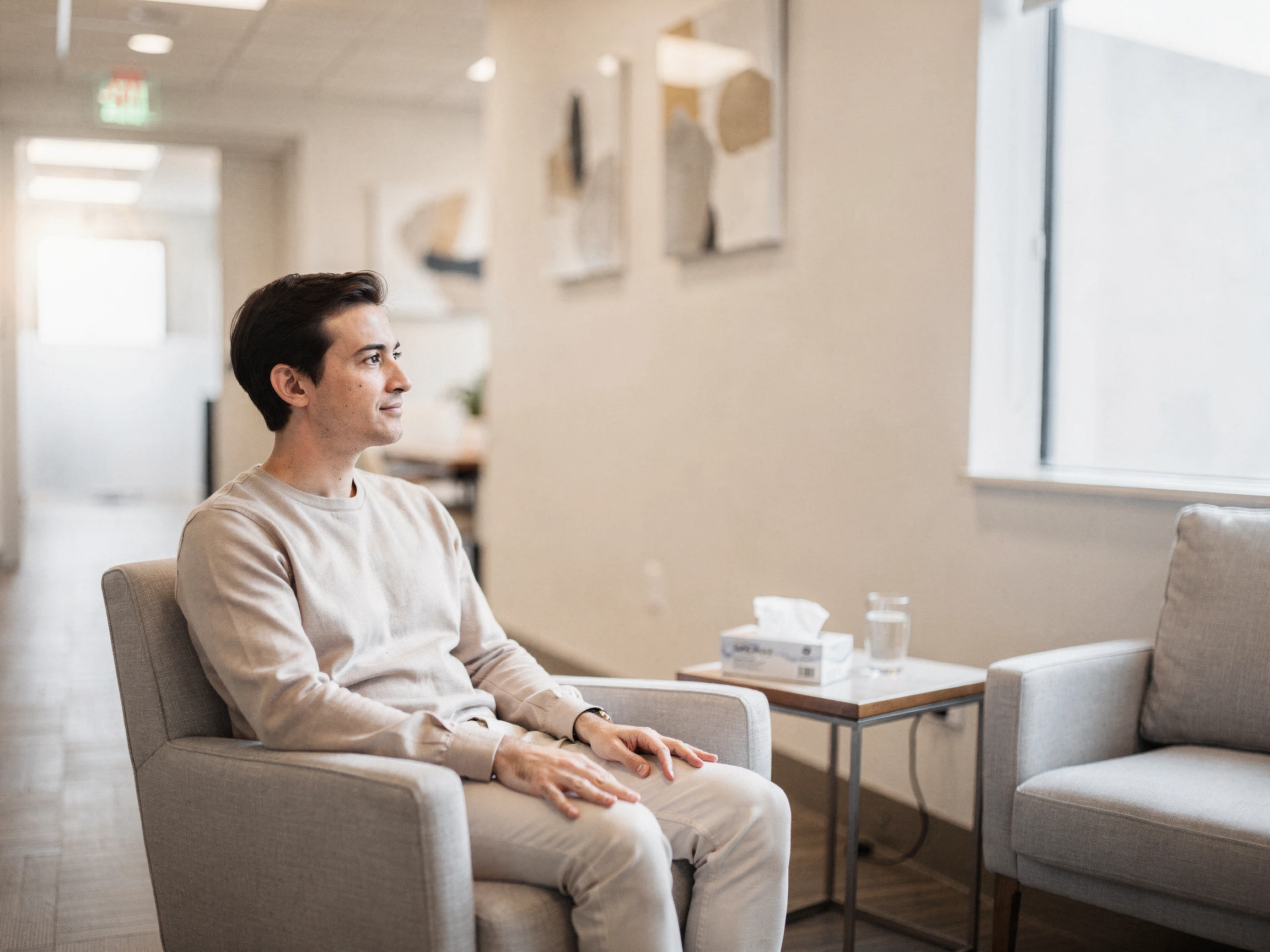 Patient sitting in a modern clinic waiting room at Texas Sinus and Snoring